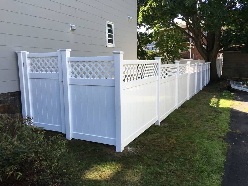 Vinyl semi-privacy fence with narrow spacing between pickets.